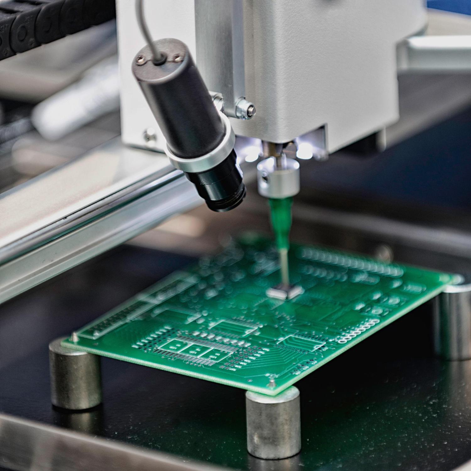 Inspection camera positioned above a printed circuit board