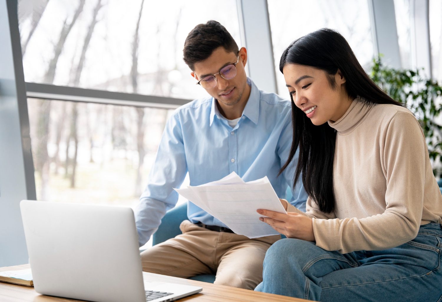 Couple reviewing application documents together